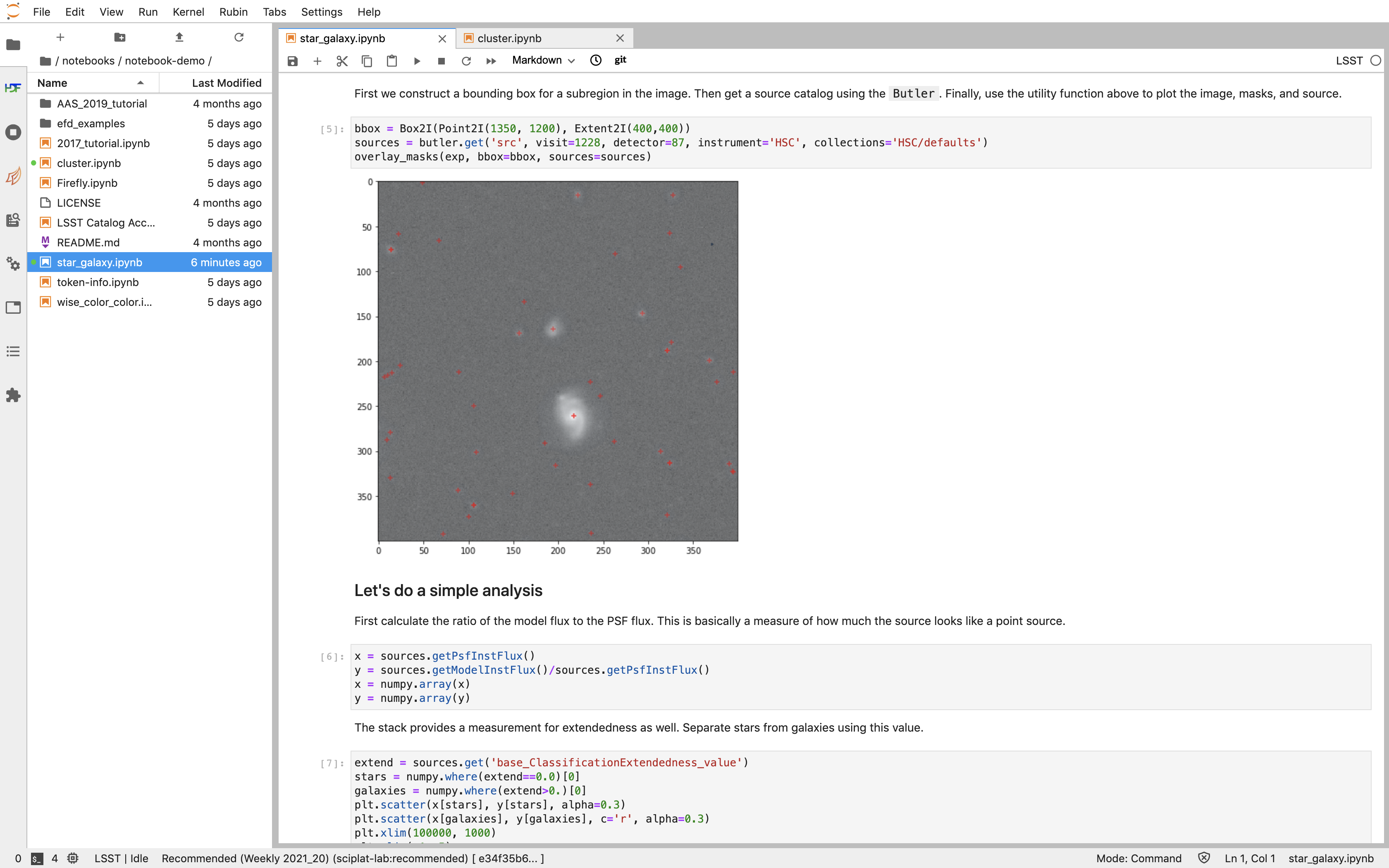 This image is a screenshot of the tutorial notebook entitled Introduction to Jupyter Notebooks for Data Preview 0.2. The notebook has been scrolled down to Section 3.3, which contains both markdown text and code cells which have been executed. The last code cell has produced a greyscale image of a rich galaxy cluster. Across the top of the notebook there is a menu bar of actions for users. Actions include save notebook, set cell type, and insert, cut, copy, paste, run, or interrupt cells.